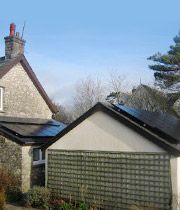 Man on roof installing bespoke design PV Solar Panels